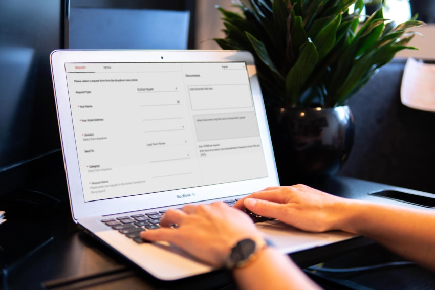 Person using laptop - legal intake and triage software