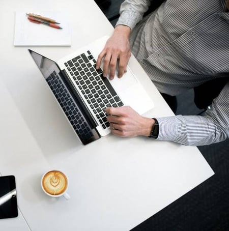 man using laptop in office