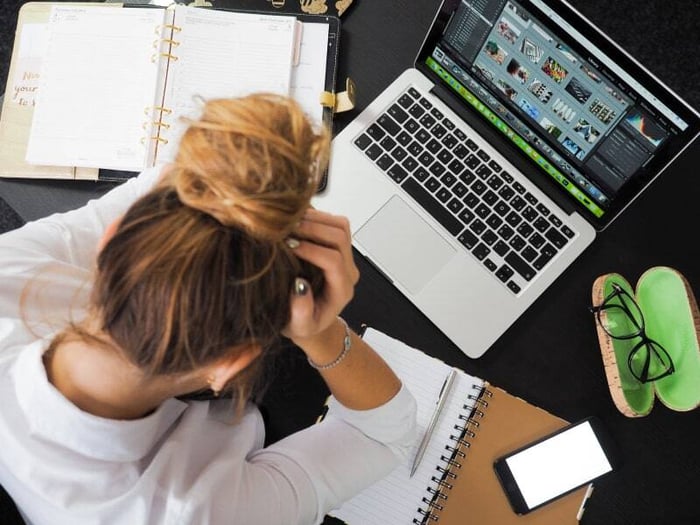 woman at laptop - stressed at work