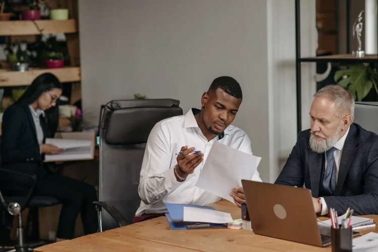 team in office reviewing documents